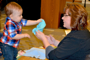 An Early Intervention Service Coordinator assesses for developmental delays.